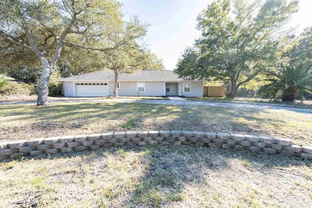 ranch-style home featuring an attached garage