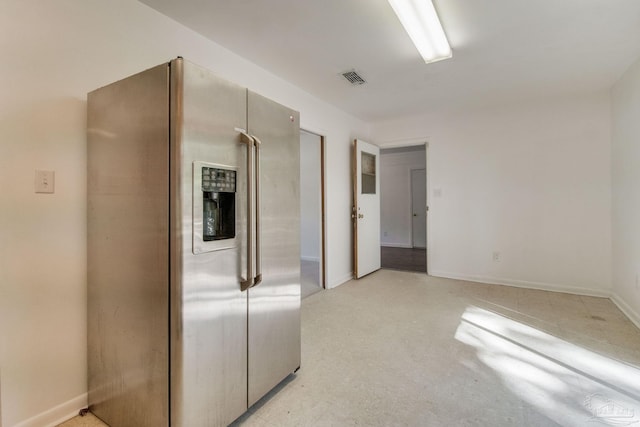 kitchen featuring stainless steel fridge with ice dispenser