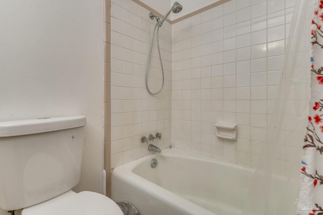 bathroom with toilet and shower / bath combo with shower curtain