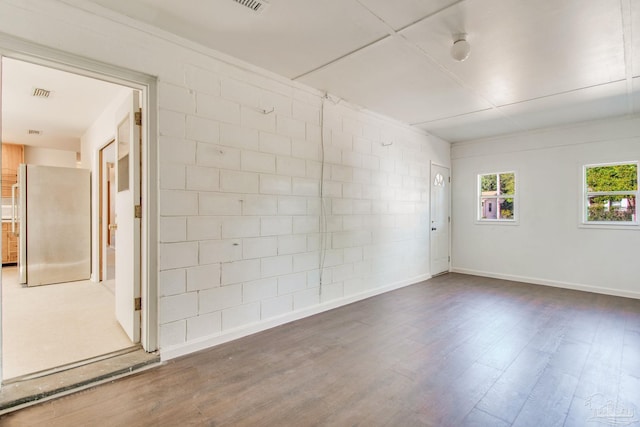 unfurnished room featuring dark wood-type flooring