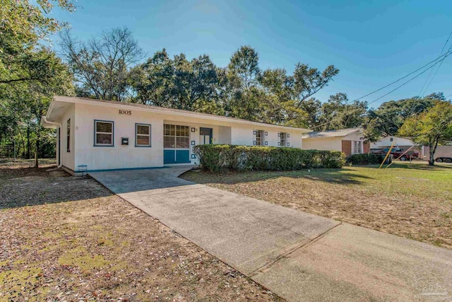 ranch-style house with a front lawn