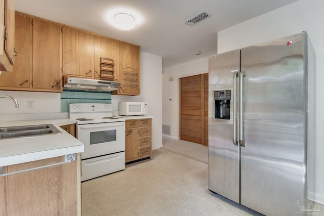 kitchen with sink and white appliances