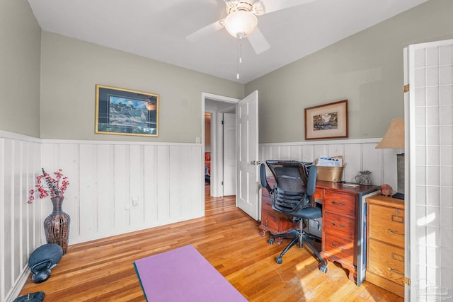 office with ceiling fan and light hardwood / wood-style flooring