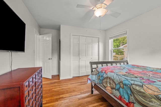 bedroom featuring light hardwood / wood-style floors, a closet, and ceiling fan