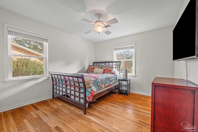 bedroom featuring ceiling fan and light hardwood / wood-style floors