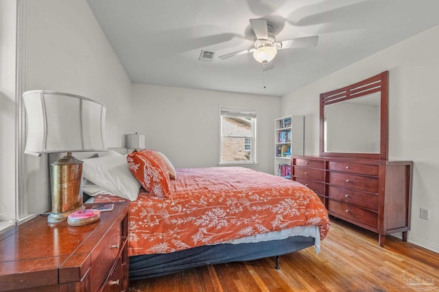 bedroom featuring hardwood / wood-style flooring and ceiling fan