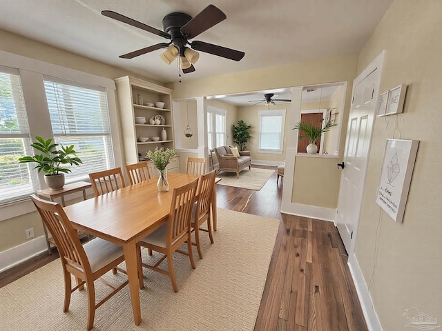 dining room with hardwood / wood-style floors and baseboards