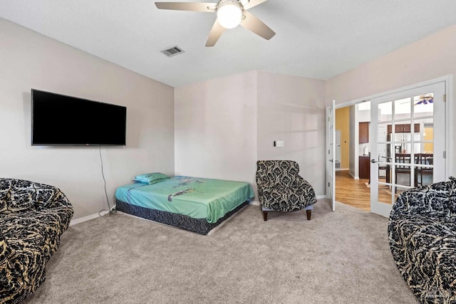 bedroom featuring ceiling fan, carpet floors, and french doors