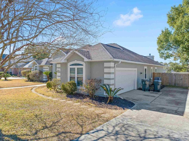 view of side of home with a garage and a lawn