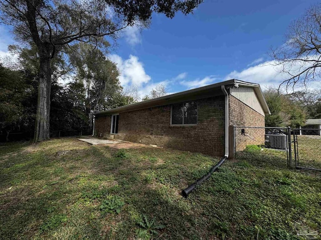 view of property exterior featuring a yard and a patio area