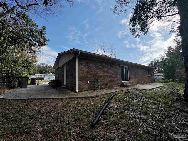 view of property exterior featuring a patio