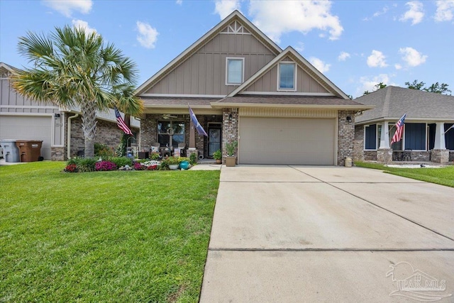 3920 Shady Grove Dr, Pace, FL 32571 - craftsman inspired home with board and batten siding, concrete driveway, a front yard, brick siding, and a garage