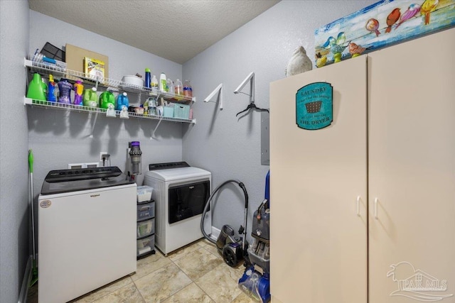 3920 Shady Grove Dr, Pace, FL 32571 - washroom featuring separate washer and dryer and a textured ceiling