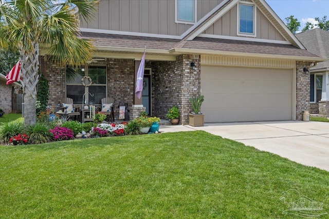 3920 Shady Grove Dr, Pace, FL 32571 - craftsman-style home featuring a porch, board and batten siding, concrete driveway, a front yard, and brick siding