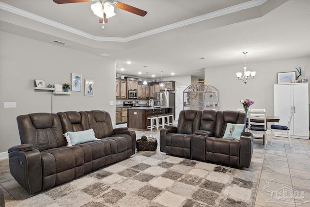 3920 Shady Grove Dr, Pace, FL 32571 - living room with ceiling fan, a chandelier, a tray ceiling, ornamental molding, and baseboards