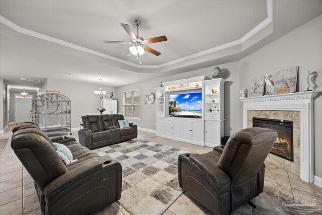 3920 Shady Grove Dr, Pace, FL 32571 - living area featuring a tray ceiling, ceiling fan, a premium fireplace, ornamental molding, and baseboards