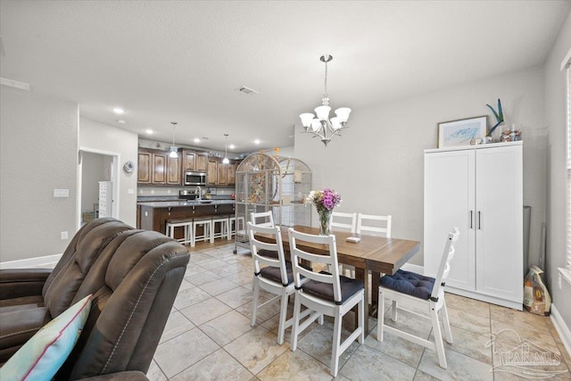 3920 Shady Grove Dr, Pace, FL 32571 - dining space with a chandelier, recessed lighting, light tile patterned floors, and baseboards
