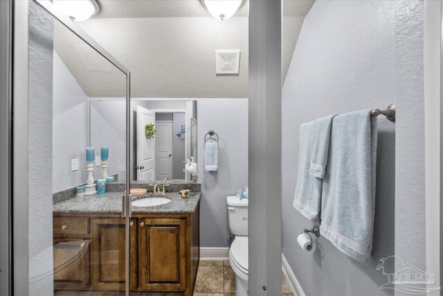 3920 Shady Grove Dr, Pace, FL 32571 - bathroom featuring vanity, toilet, baseboards, and a textured wall