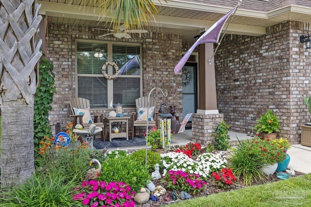 3920 Shady Grove Dr, Pace, FL 32571 - doorway to property featuring brick siding, covered porch, and ceiling fan