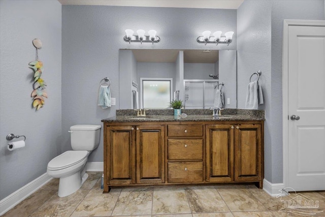 3920 Shady Grove Dr, Pace, FL 32571 - bathroom with a stall shower, double vanity, toilet, and baseboards