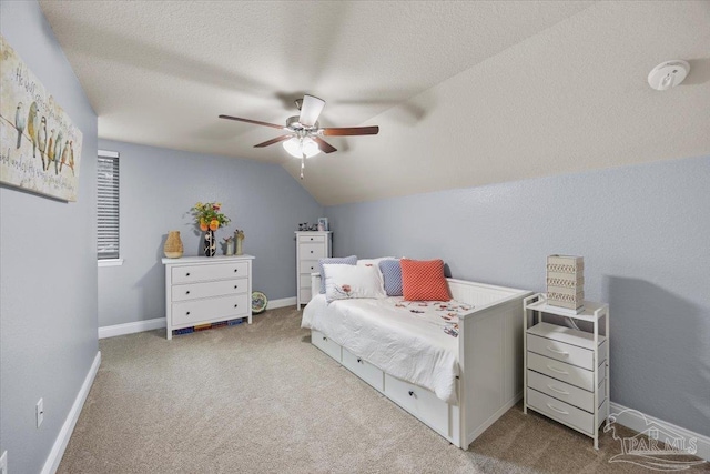 3920 Shady Grove Dr, Pace, FL 32571 - carpeted bedroom with vaulted ceiling, a textured ceiling, ceiling fan, and baseboards