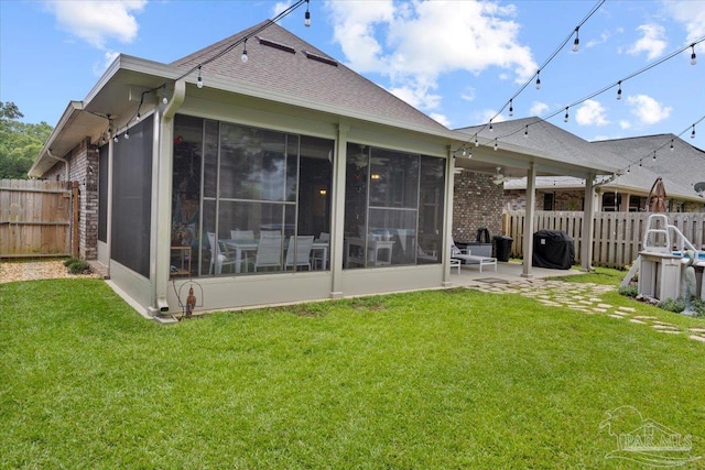 3920 Shady Grove Dr, Pace, FL 32571 - back of property featuring a sunroom, a shingled roof, and brick siding