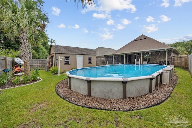 3920 Shady Grove Dr, Pace, FL 32571 - view of swimming pool featuring a sunroom and an outbuilding