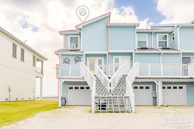10443 Gulf Beach Hwy Unit 1, Pensacola, FL 32507 - view of front of property featuring a front yard, driveway, stairway, and an attached garage