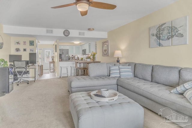 10443 Gulf Beach Hwy Unit 1, Pensacola, FL 32507 - living room with light carpet, visible vents, and a ceiling fan