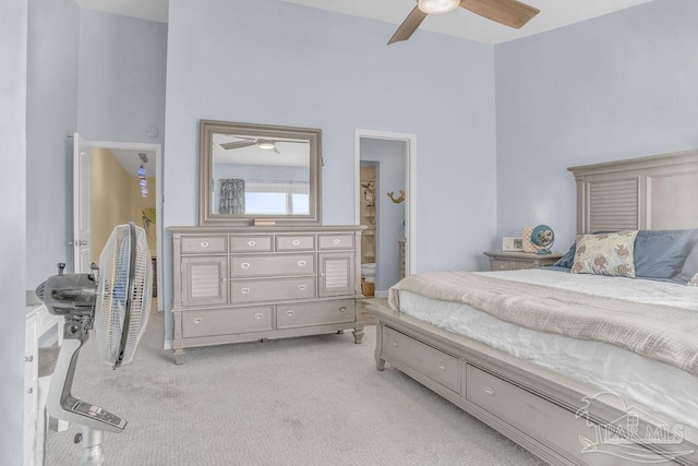10443 Gulf Beach Hwy Unit 1, Pensacola, FL 32507 - bedroom with a towering ceiling, ensuite bathroom, light colored carpet, and ceiling fan