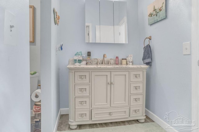 10443 Gulf Beach Hwy Unit 1, Pensacola, FL 32507 - bathroom featuring baseboards and vanity