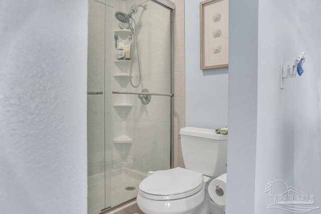 10443 Gulf Beach Hwy Unit 1, Pensacola, FL 32507 - bathroom featuring toilet and a shower stall