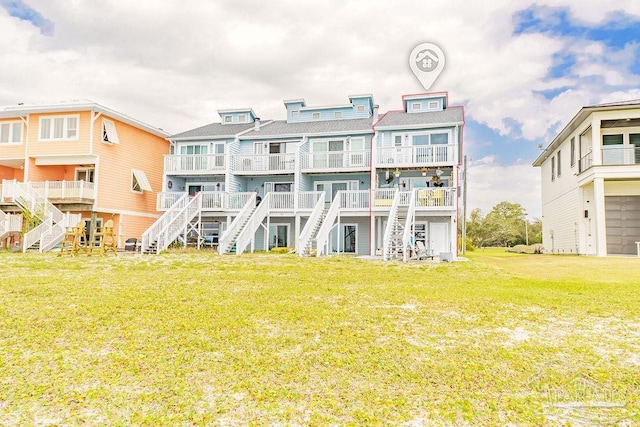 10443 Gulf Beach Hwy Unit 1, Pensacola, FL 32507 - back of property with a yard and stairs