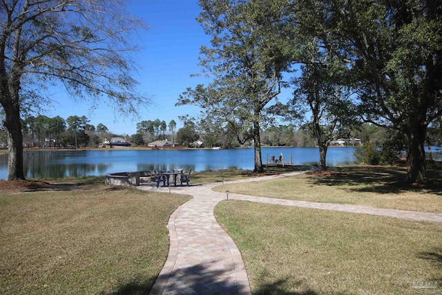 exterior space featuring a water view and a yard