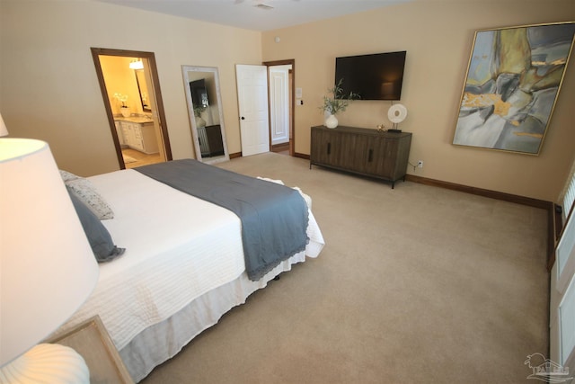 carpeted bedroom featuring baseboards