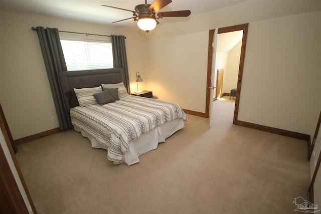 bedroom featuring baseboards, a ceiling fan, and light colored carpet