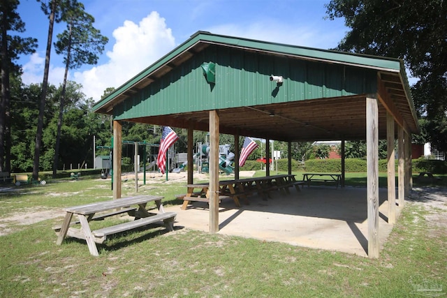 surrounding community featuring a detached carport, playground community, and a lawn