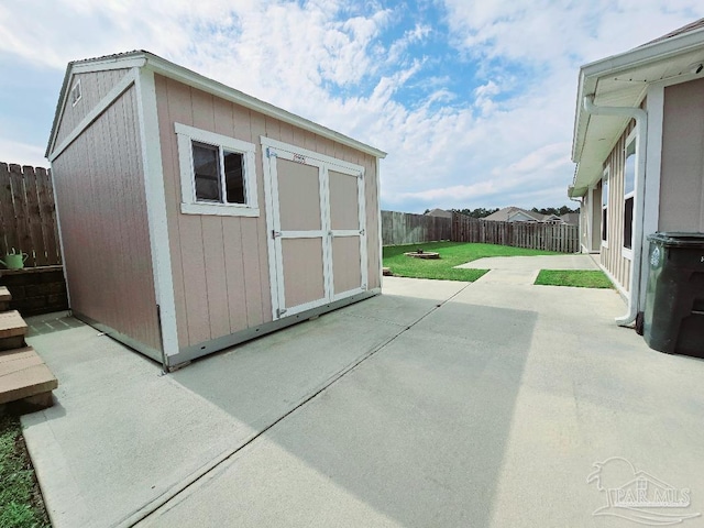 view of shed featuring a fenced backyard