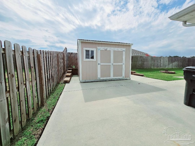 view of shed featuring a fenced backyard