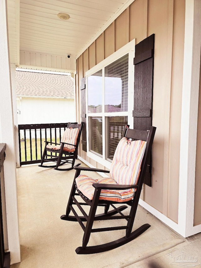 balcony featuring a sunroom and covered porch