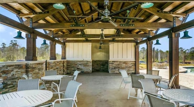 view of patio with outdoor dining space and a gazebo