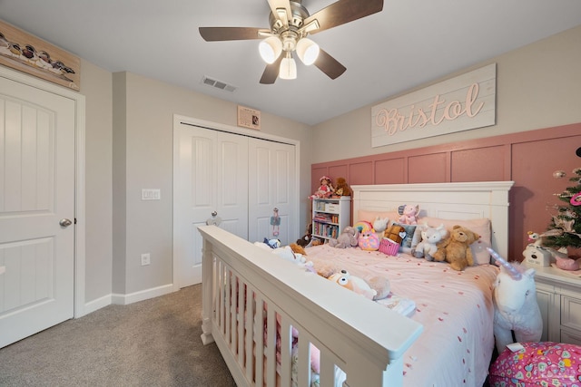 carpeted bedroom featuring a closet and ceiling fan