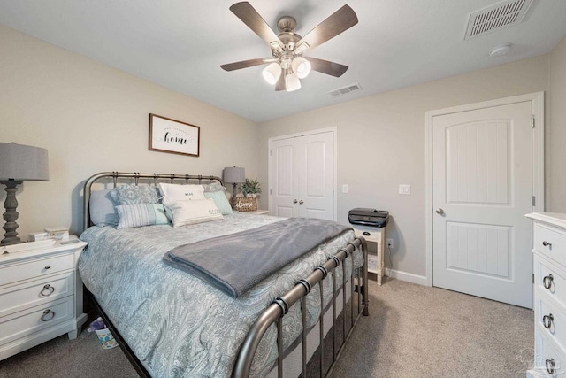 carpeted bedroom featuring a closet and ceiling fan