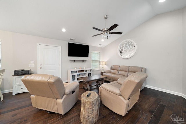 living room with ceiling fan, dark hardwood / wood-style floors, and vaulted ceiling