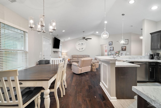 dining area featuring ceiling fan, lofted ceiling, dark hardwood / wood-style flooring, and sink