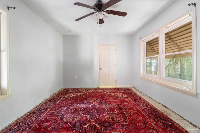 unfurnished room with ceiling fan