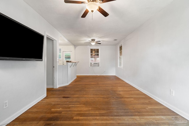 unfurnished living room with ceiling fan and wood-type flooring