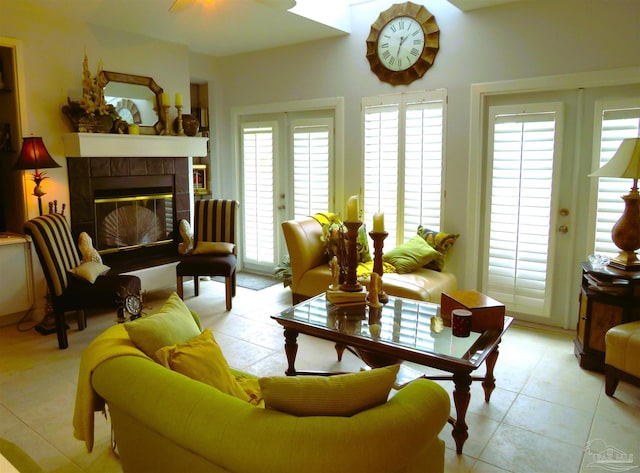 interior space featuring a healthy amount of sunlight, a fireplace, and french doors