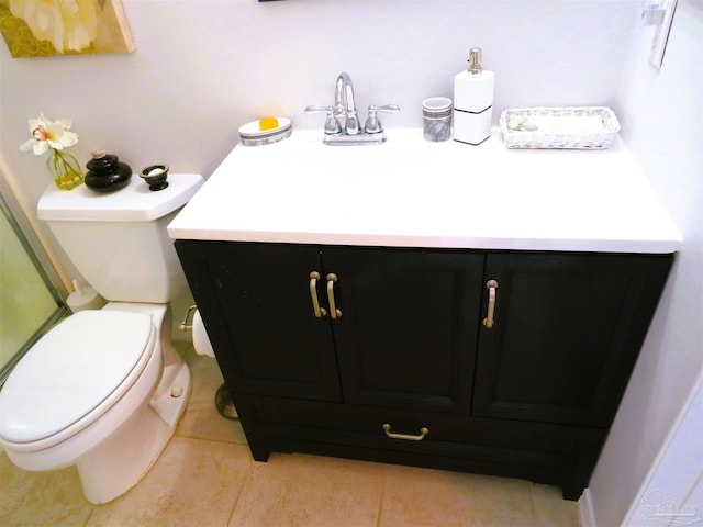 bathroom with vanity, tile patterned floors, and toilet