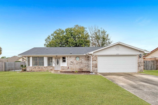 single story home with a garage and a front lawn